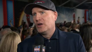A man talking into a microphone. Kevin Feige at the premiere of Spider-Man: No Way Home