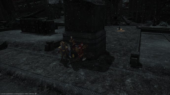 A party crouches behind a large, dark pillar in Final Fantasy XIV Endwalker