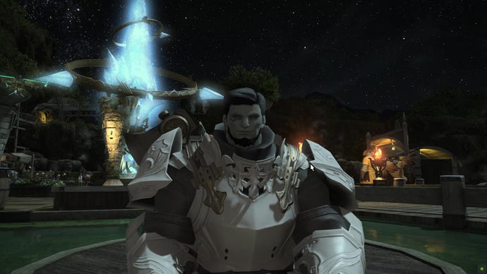An image from Final Fantasy XIV which shows Shadow Hulk smiling for the camera, with a big blue crystal swirling behind him in the background.