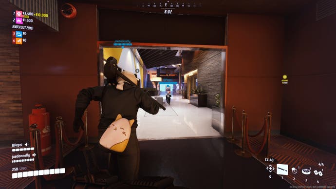 A screenshot of a match in action in The Finals. Bertie's group runs through shiny casino hallways. Directly in front of Bertie is a large player character with a sledgehammer slung over their back, and a kawaii bun bag.