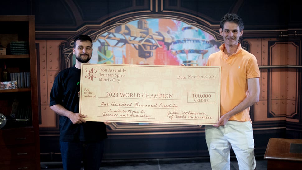 Flesh and Blood TCG world champion Alexandros Argyriou with a massive cheque at the 2023 World Championship in Barcelona, Spain