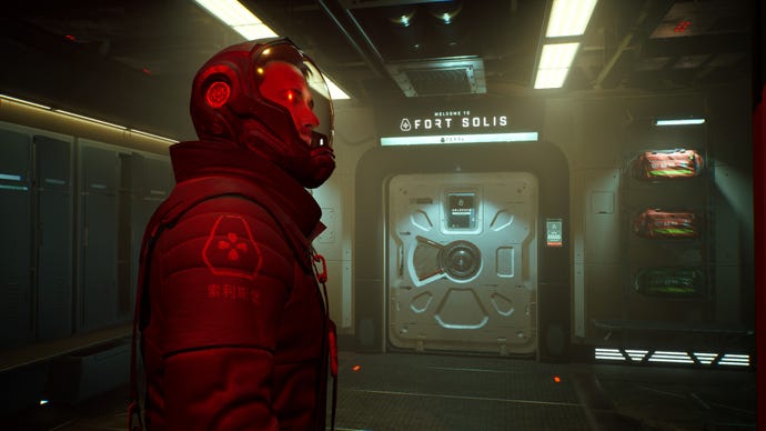 A concerned man in a red space suit stands in a corridor in Fort Solis