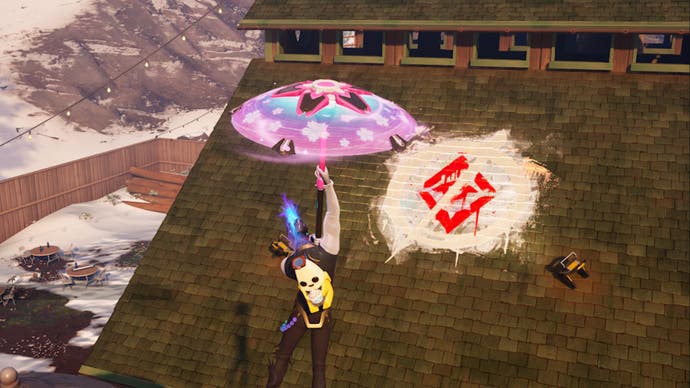 fortnite c5s1 character facing the underground graffiti symbol on the roof