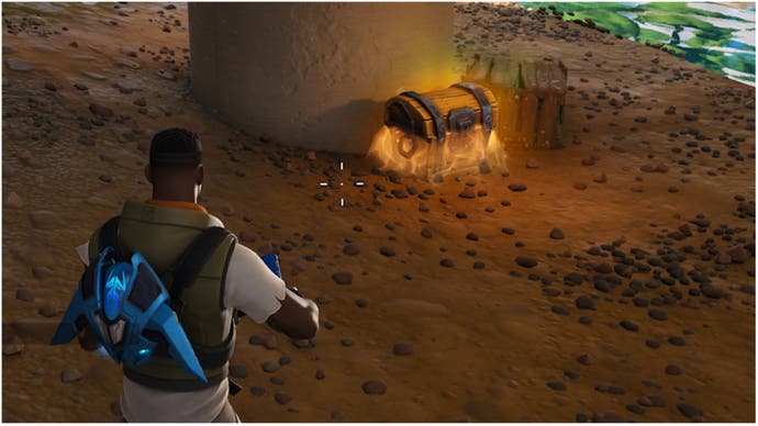 Fortnite, a character looks at a loot chest.