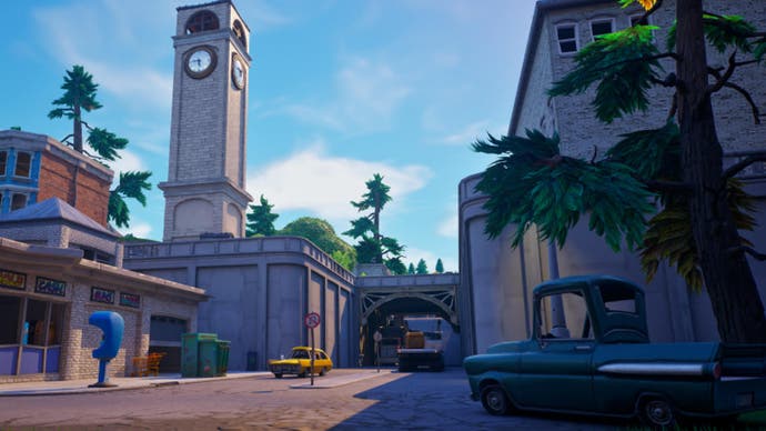 Illustration officielle d'Epic Games de Fortnite OG représentant des tours inclinées montrant une rue, avec une voiture à droite et une haute tour d'horloge en arrière-plan à gauche.