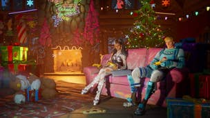 Fortnite presents: A blonde, white man and a woman with dark hair sit on a pink sofra. A decorated tree is behind them and a large fire is blazing in a brick fireplace at the back of the room