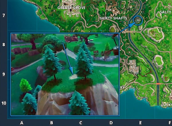 Fortnite Suche zwischen einer Metallbrücke, drei Werbetafeln und einem