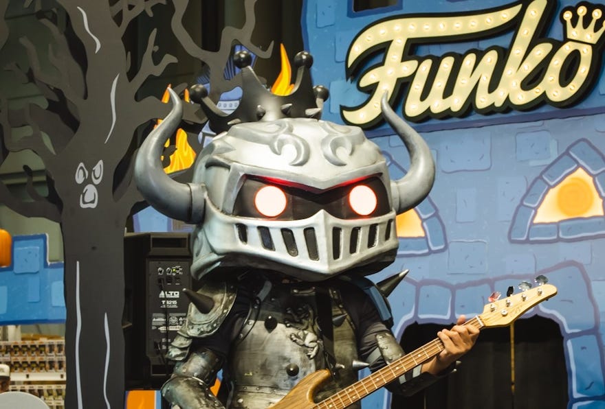 Cropped photo of a Funko playing a guitar
