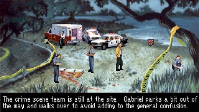 Gabriel Knight arrives at a waterside crime scene in Gabriel Knight: Sins Of The Fathers. An ambulance and several police cars stand nearby, and some officers and paramedics are examining a partially-covered corpse.