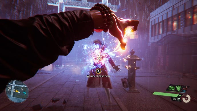 A PR screenshot of combat in Ghostwire: Tokyo, showing the main character Akito pulling the core out of a spirit with an overarm pull from a distance