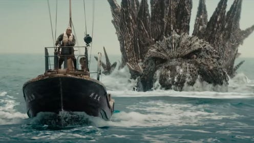 Still image of Godzilla coming after a boat