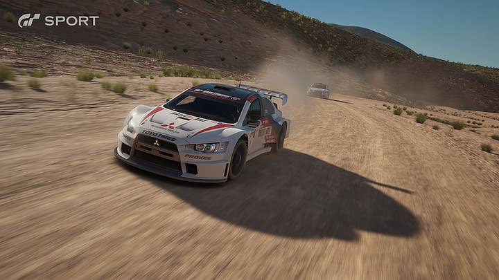 GT Sport screenshot of a rally car racing across a desert track
