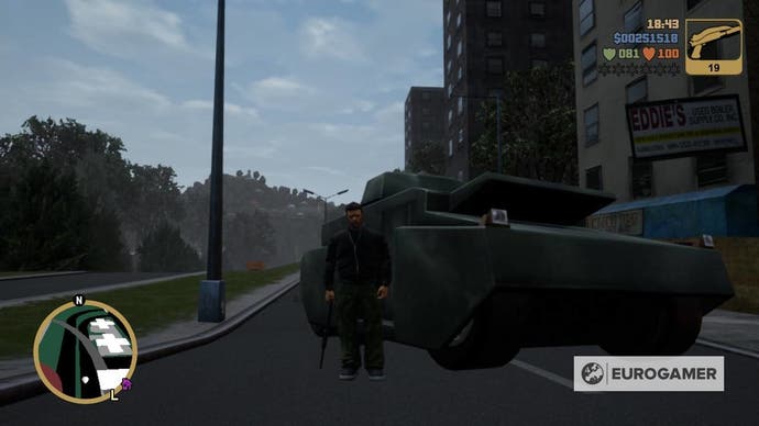 Claude -Geschwindigkeit hält eine Pistole auf einer Straße neben einem Panzer in GTA 3