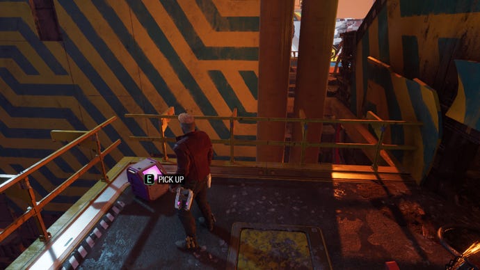 Star-Lord stands by outfit box with stripey wall nearby