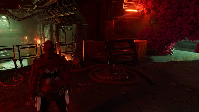 Star Lord standing at a barrier in Guardians of the Galaxy with a small hole to the right that leads to an outfit.