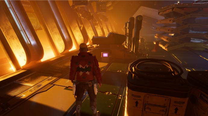 Star-Lord stood near outfit box surrounded by yellow machinery