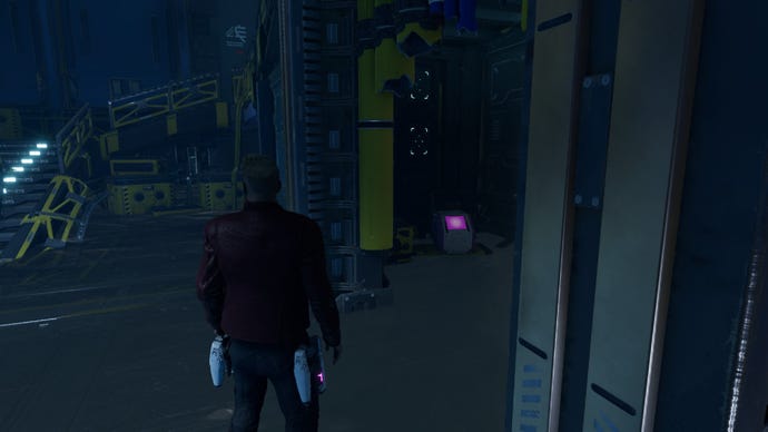 Star-Lord stood in water with outfit box through doorway