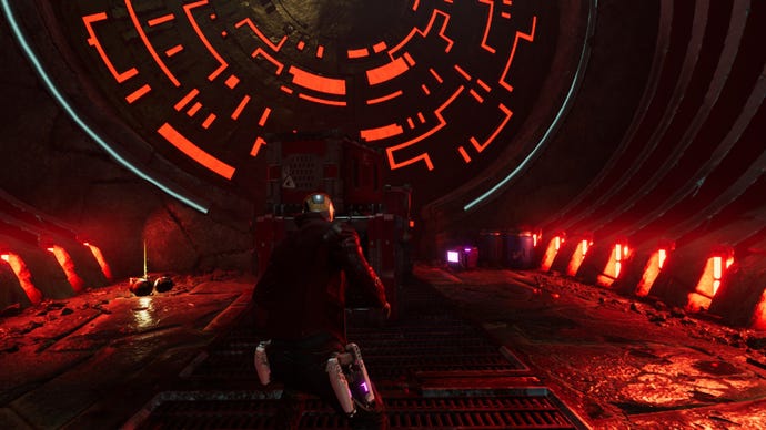 Star-Lord standing in room illuminated red with crates up ahead. Outfit box on the right and components on the left
