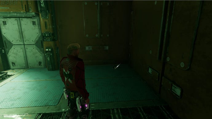 Star-Lord stands in a corridor with the spinal cord in the corner