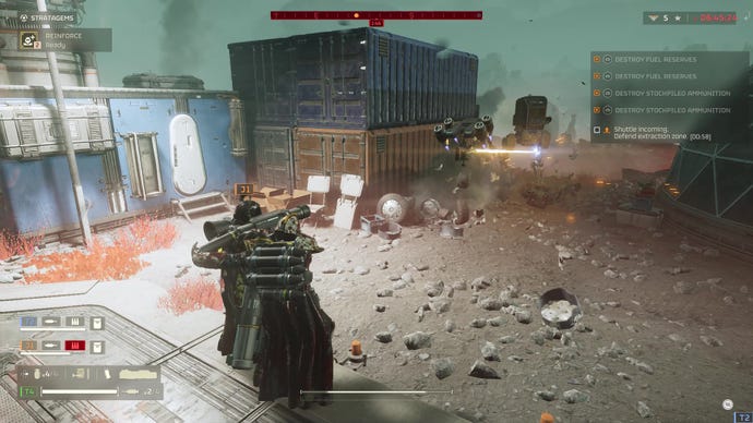 Helldivers 2 soldiers arm a rocket launcher.