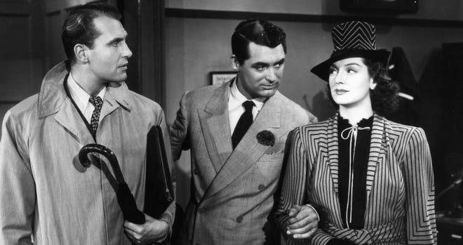 Still black and white image featuring Ralph Bellamy, Cary Grant, and Rosalind Russell
