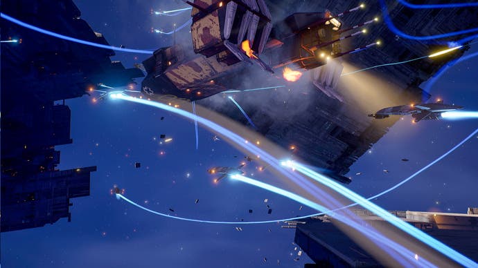 Small fighter spaceships with glowing blue exhaust trails fly and fight amongst giant wreckage debris.
