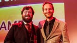 Johnny Chiodini and Ian Higton stand arm in arm after collecting a Games Media Award for Best Streamers, which was awarded to the Eurogamer video team. They are both very smartly dressed and very happy.