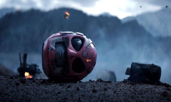 Movie still featuring a pink helmet lying on its side