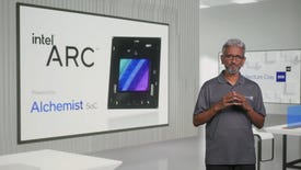 Intel executive Raja Koduri standing next to a presentation on Intel Arc GPUs.