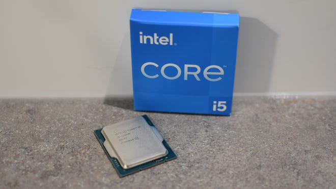 The Intel Core i5-12600K CPU next to its box.