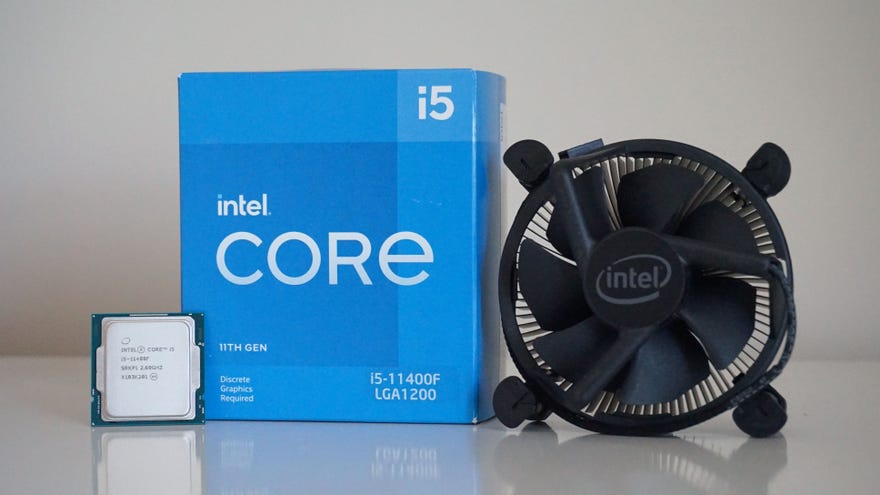 Intel's Core i5-11400F processor next to its box and bundled cooler