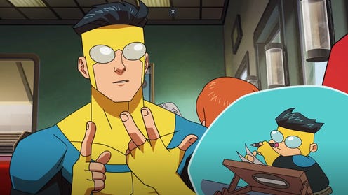 Character in a blue and yellow superhero suit sitting in a diner with a small chibi version drawing at a table