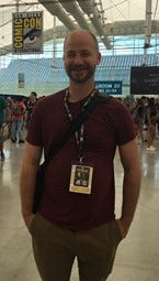 Image of Jack Wallace at San Diego Comic Con wearing a burgundy shirt