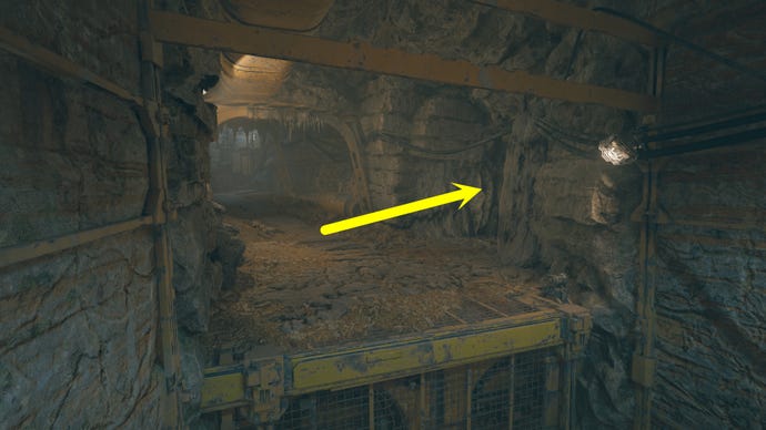 A cave passage on Koboh in Jedi: Survivor, with an arrow pointing to the right where Vashtan Wolfe's Lair can be found.