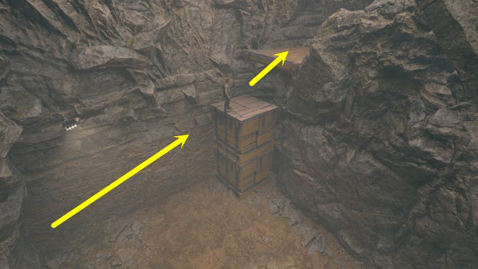 Cal stands atop a stack of cubes to reach a higher ledge in the Winding Ravine in Jedi: Survivor.
