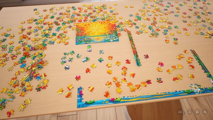 Ein virtueller Puzzle eines Sonnenuntergangs über Wasser, der in Stücken auf einem Tisch in Puzzletäumen ausgelegt ist