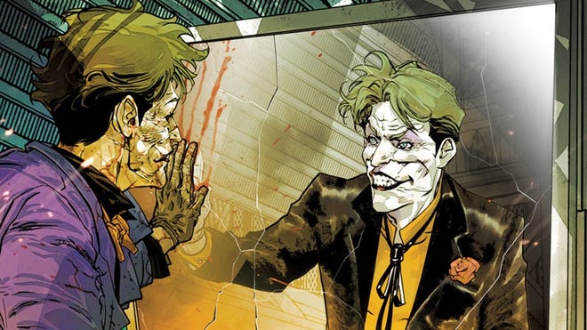 Joker touches his reflection