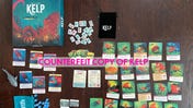Photo of counterfeit copy of Kelp board game posted to Wonderbow Games' website