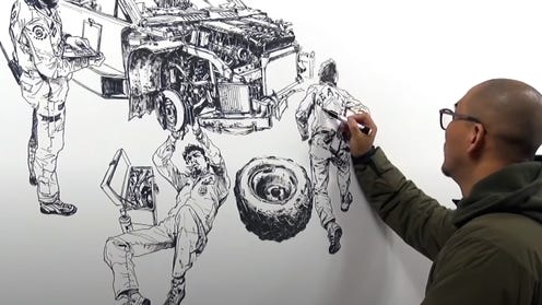 Screenshot image of Kim Jung Gi drawing on a large sheet of paper with pen