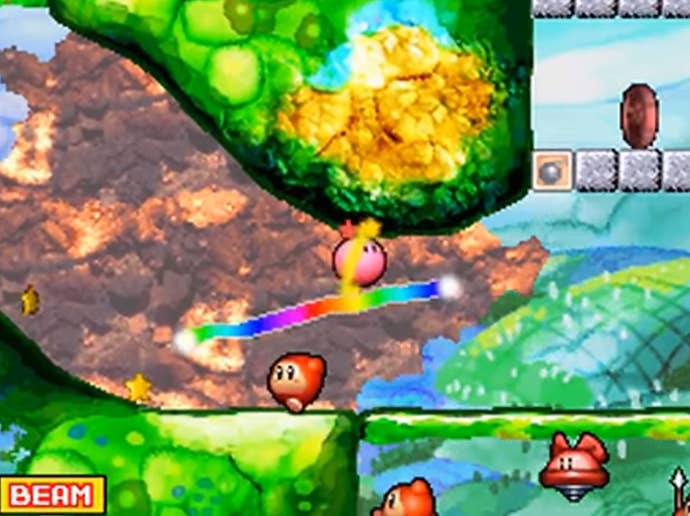 A player draws a path to escort Kirby in Kirby Canvas Curse.