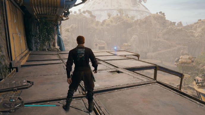Cal stands on a high metal platform and walks towards an essence on Koboh in Jedi: Survivor.