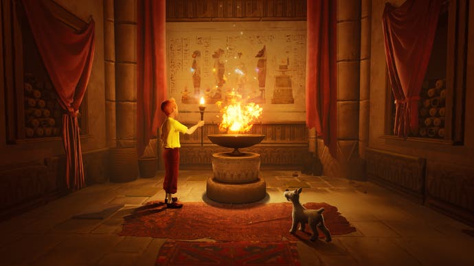 In einer Art Wärmekammer, in der ein Kohlenbecken brennt und ein junger Mensch mit einem Hund ägyptische Hieroglyphen an der Wand betrachtet.  Es sind Tim und Snowy.