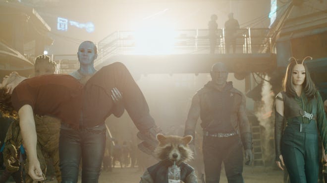 Still promotional image featuring the Guardians of the Galaxy wearing civilian clothes walking side by side