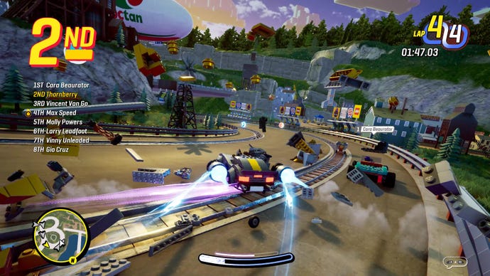 A screenshot from Lego 2KDrive which shows a muscle car drifting around a corner, flinging debris everywhere.