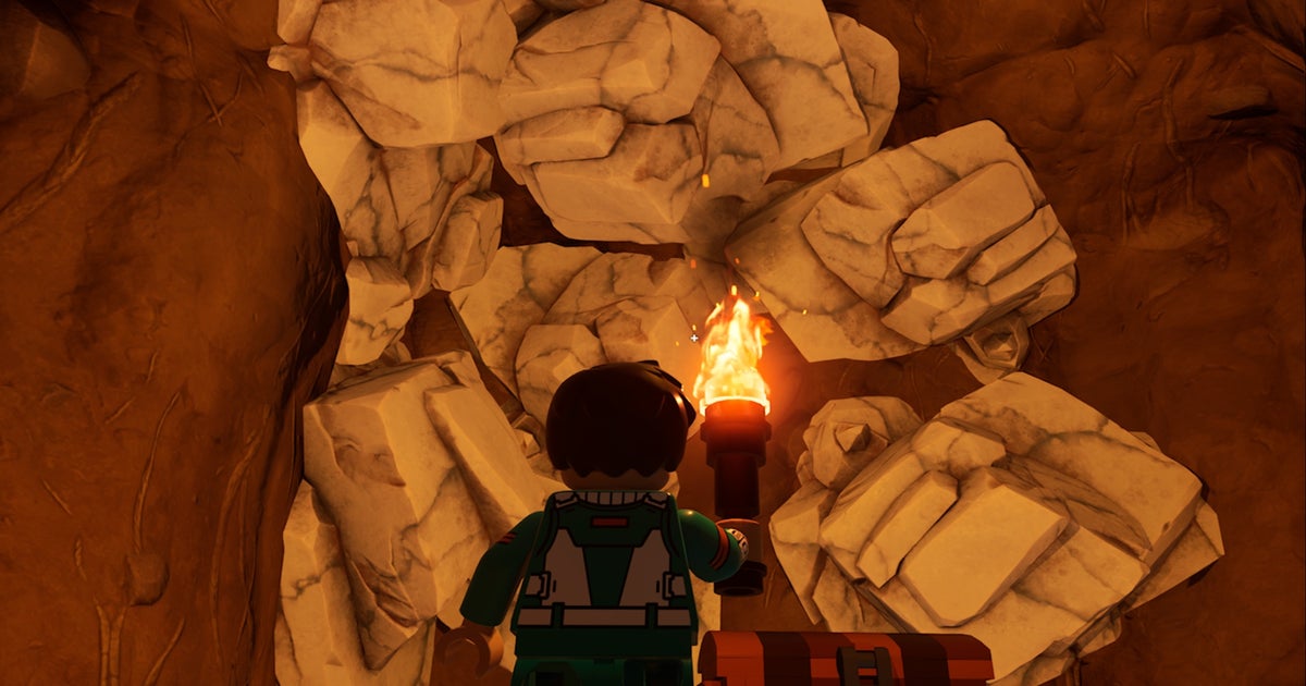 Lego Fortnite Character Facing Marble In Cave With A Torch ?width=1200&height=630&fit=crop&enable=upscale&auto=webp
