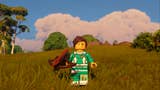 lego fortnite character holding crossbow on grassy hill