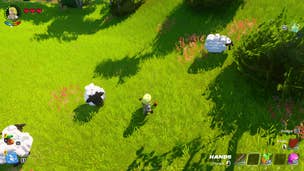 A LEGO Fortnite character stands in a meadow amid a trio of sheep, examining some fertiliser on the ground.