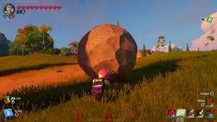 Power Chord rolling a boulder up a grassy hill in LEGO Fortnite