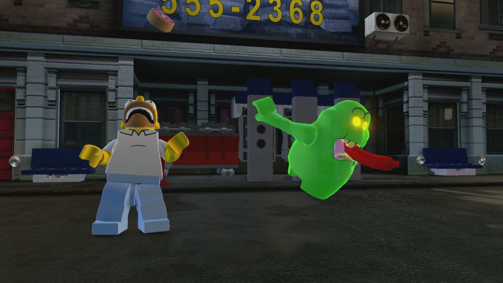 The Simpsons in-game screenshots for LEGO Dimensions show Homer hanging with Slimer |