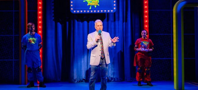 Promotional image featuring Mark Summers on stage